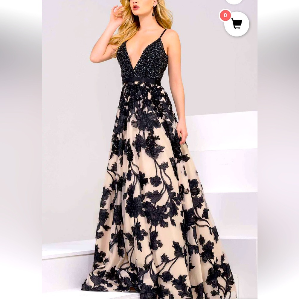 Stunning Jovani style 47604. Color is Nude/Black. Size 8.